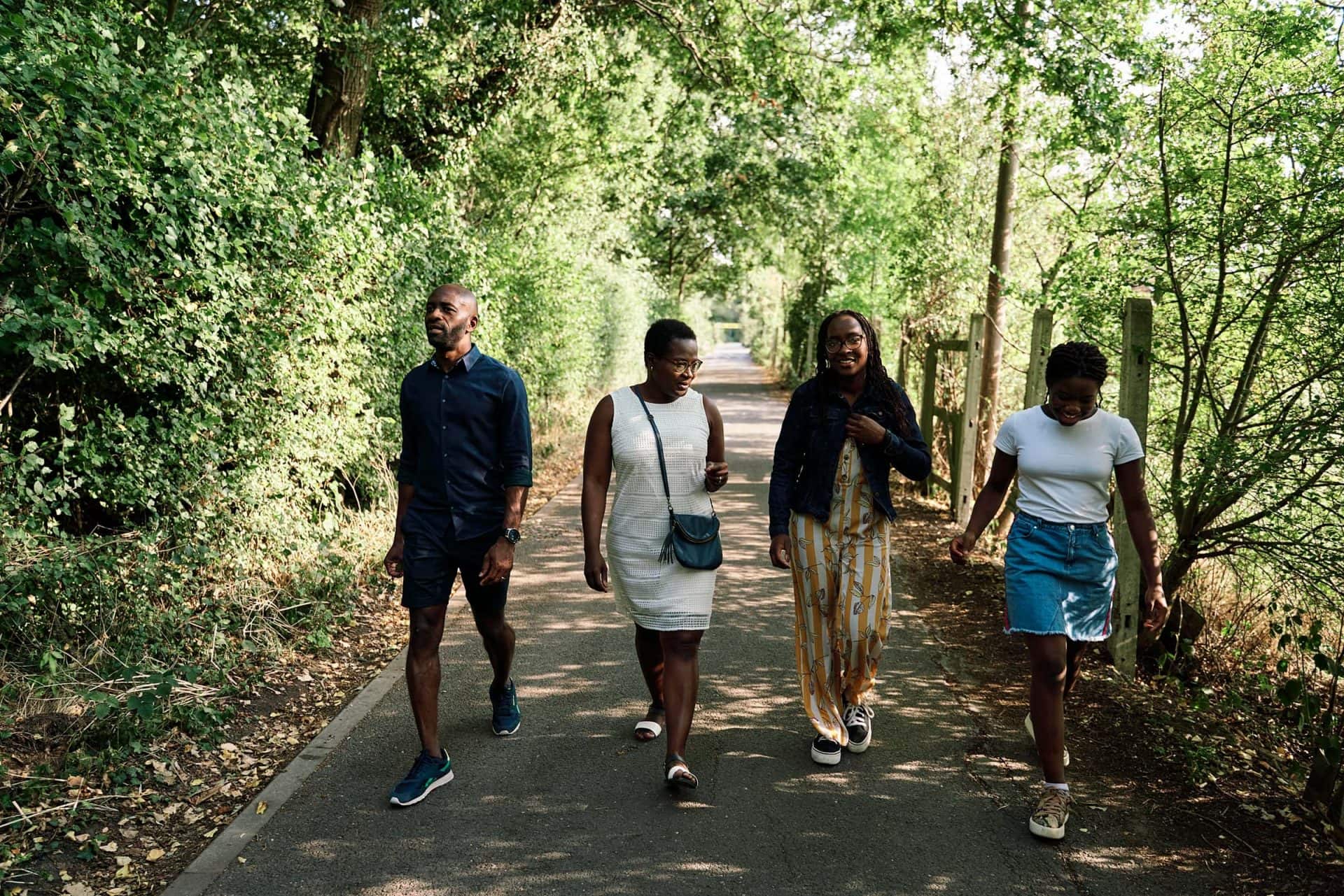 Family walking outside in a park during a photography session in Bickley London
