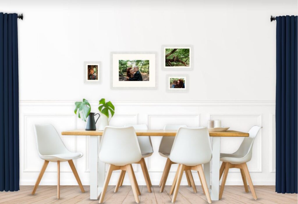 Eclectic family photo gallery wall above the dining table