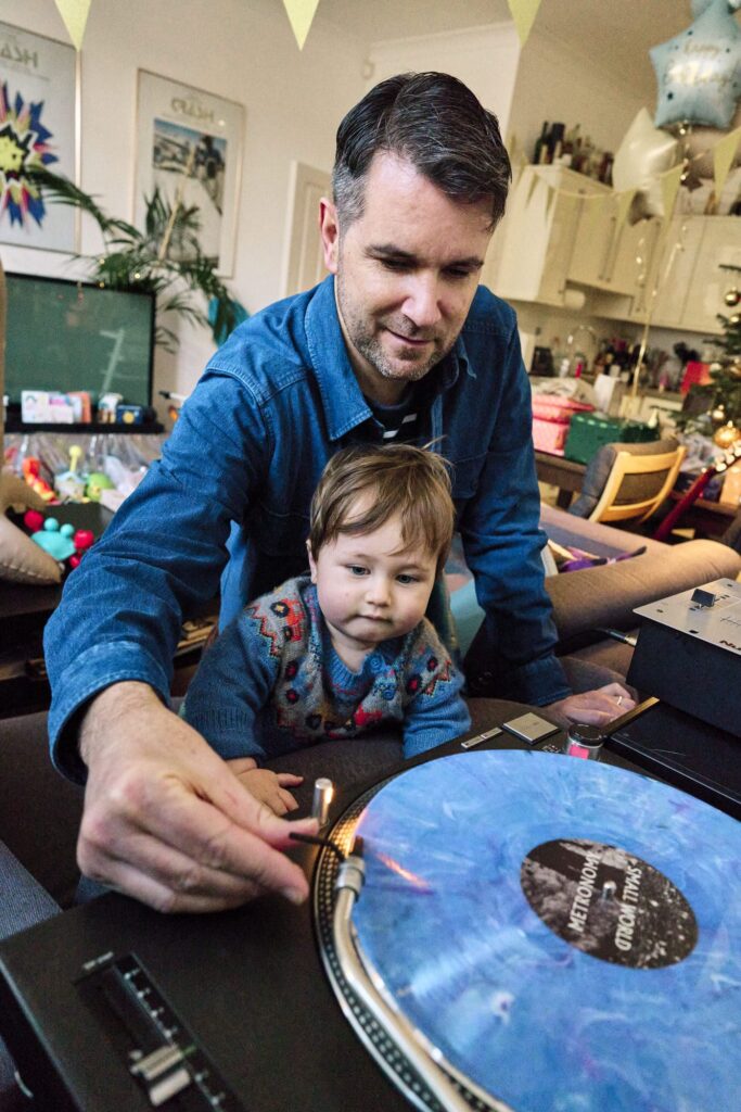 print credit with your family photo collection will make the most of your images like this father playing music with his son.